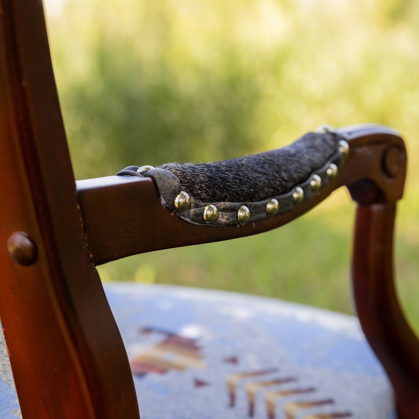 Arm Detail with hair on hide, leather trim and chrome nail heads