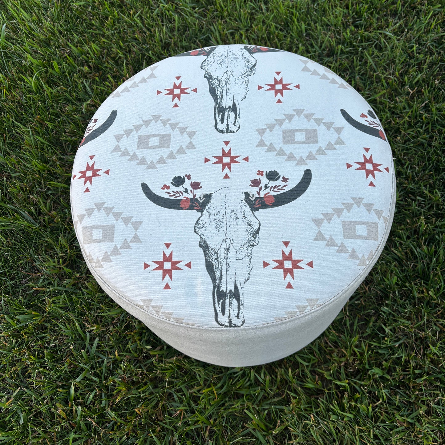 Outdoor top view of western-style ottoman placed on grass