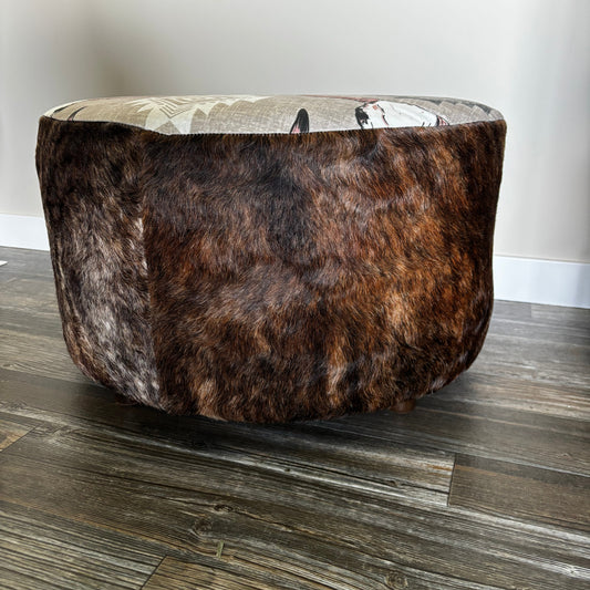 Side view of ottoman showing brindle hair-on-hide upholstery