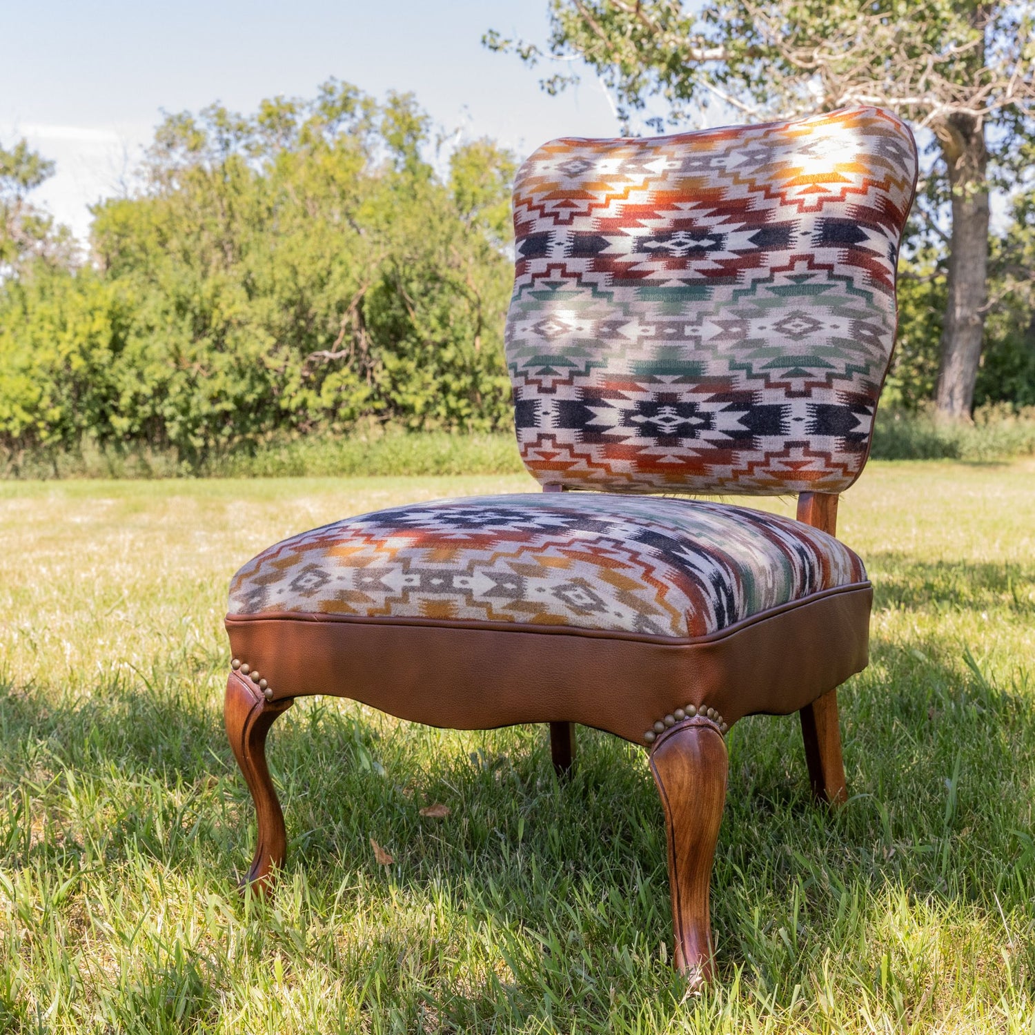 A past piece from blue dog fabric designs, aztec fabric and leather occasional chair