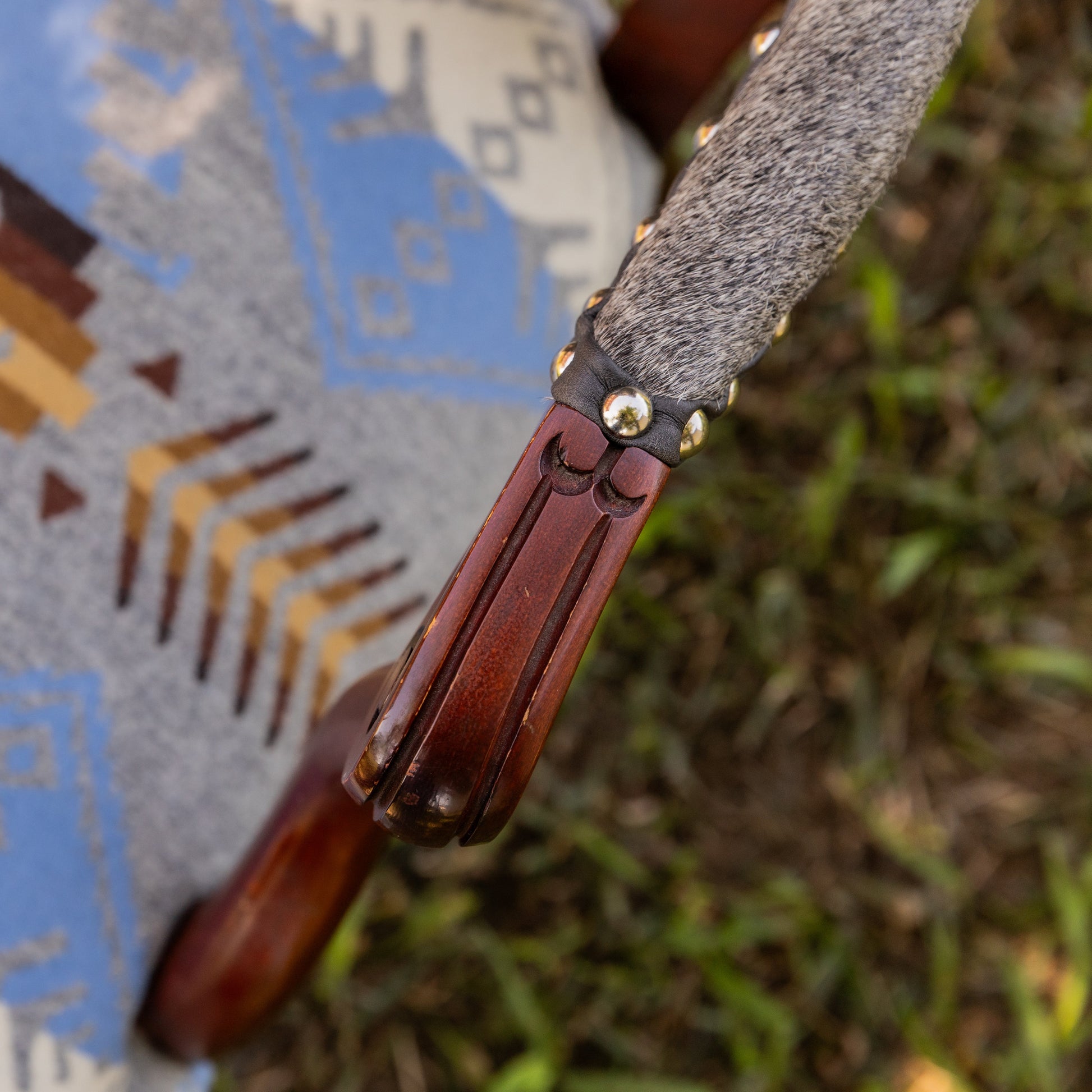 Arm detail Pendleton Seat with grey hair on hide detail and chrome nail heads