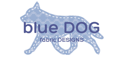Logo of blue dog fabric designs with a western aztec design overlayed on a cattle dog