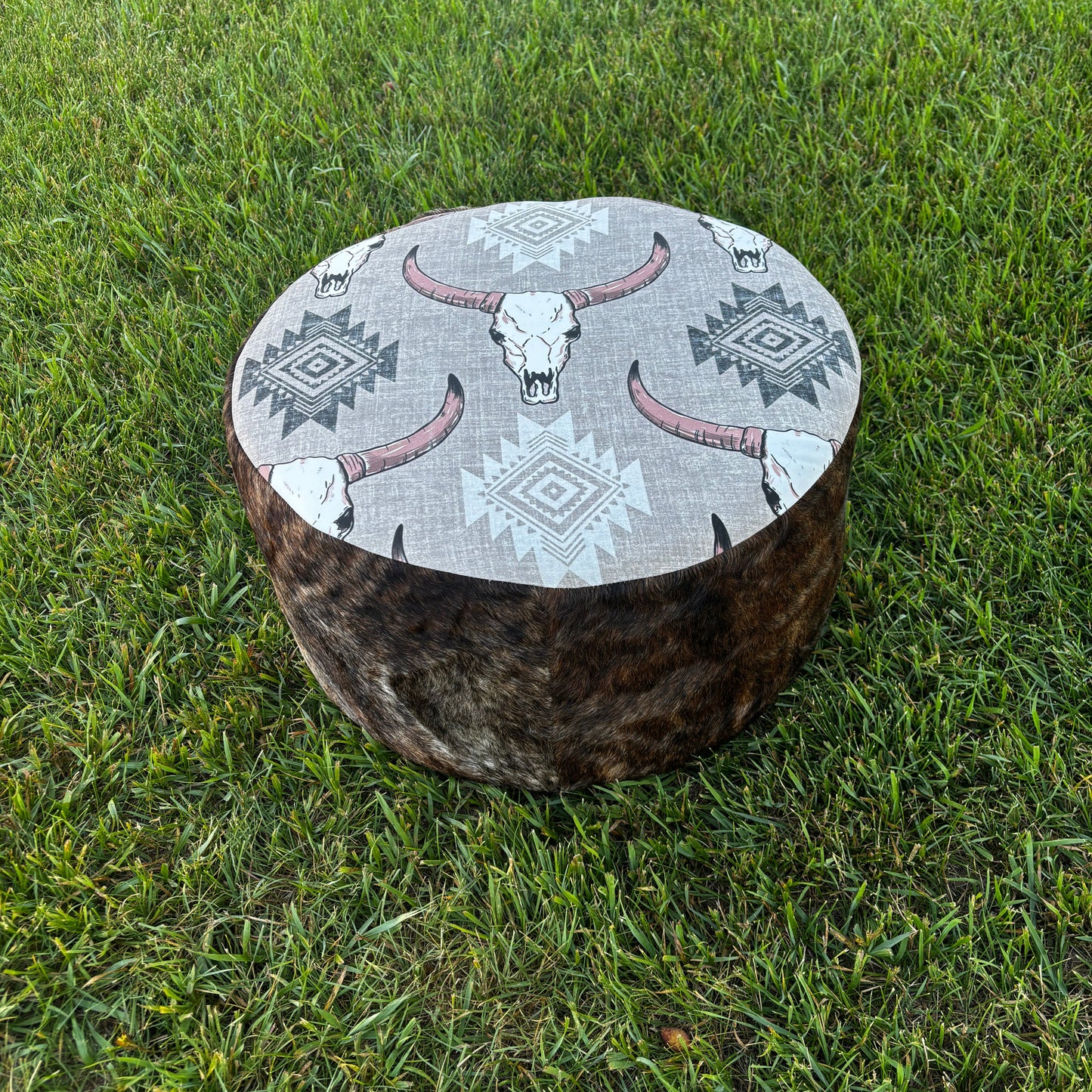 Full outdoor view of ottoman placed on green grass