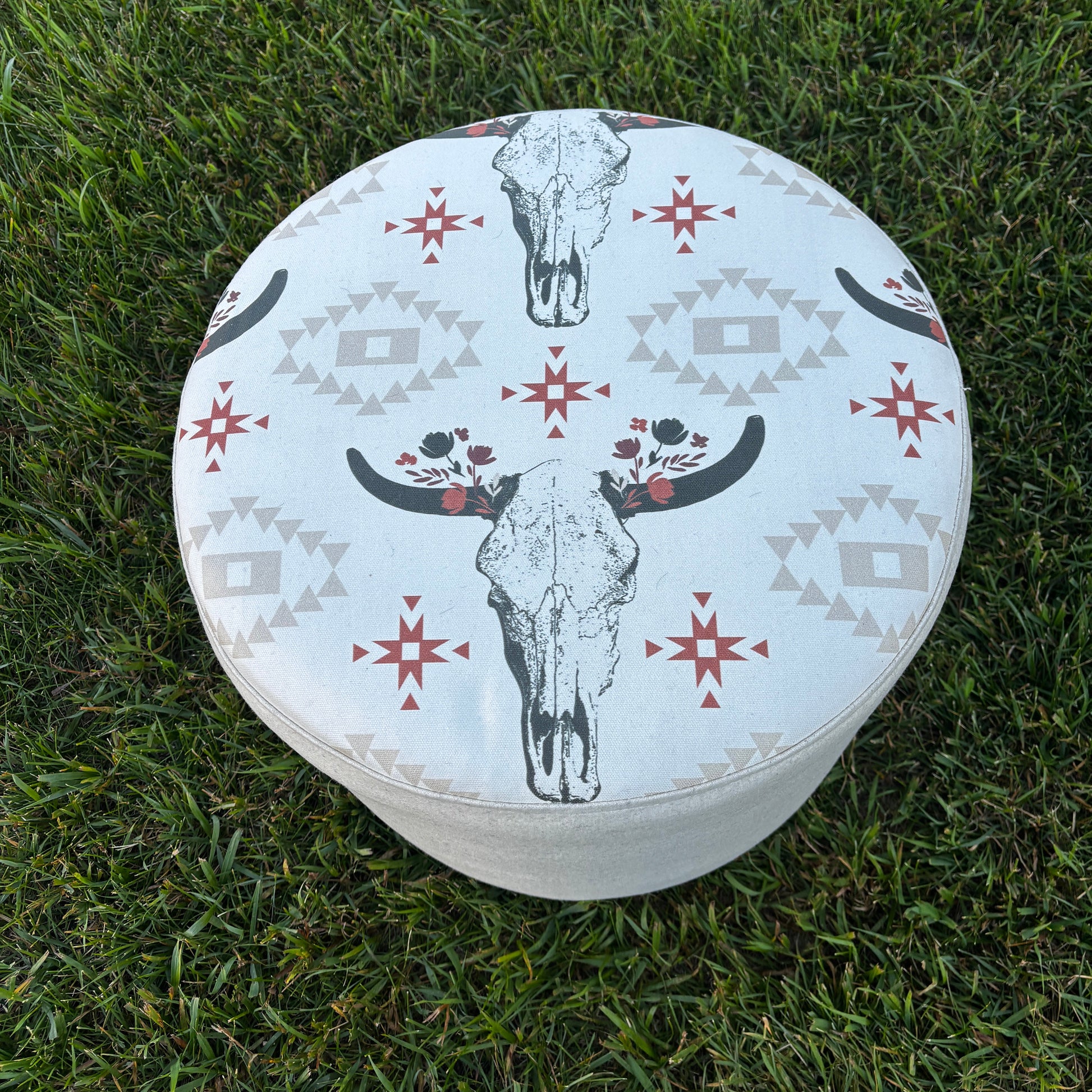 Outdoor top view of western-style ottoman placed on grass