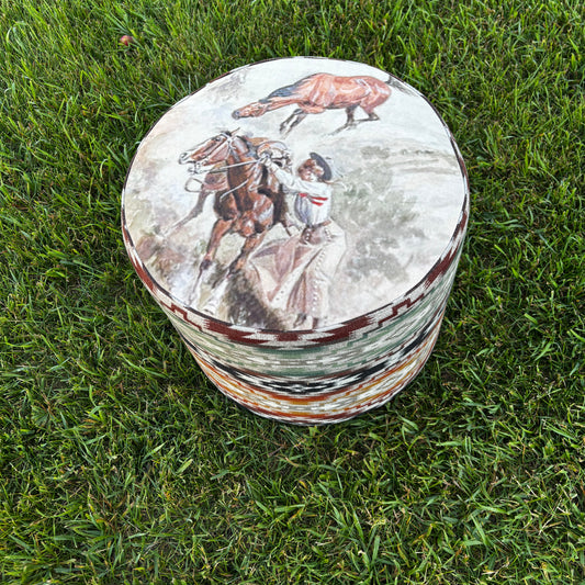 Outdoor view of ottoman on grass showcasing top art print