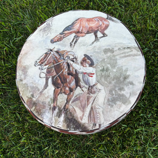 Overhead view of Western ottoman with cowboy and horse painting